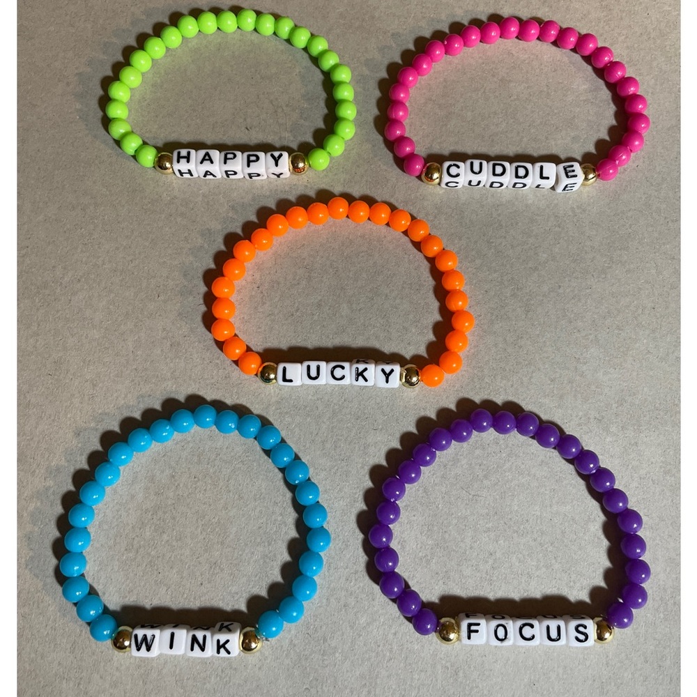 Bracelets-Personalized name, or team or jersey number.  Stretch cord. Any size